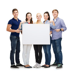 Wall Mural - group of smiling students with white blank board