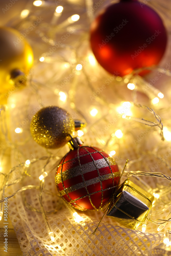 Christmas ornaments and garland on bright background close-up