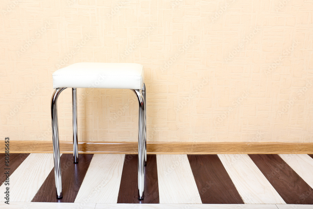 Beautiful interior with modern leather chair on wood floor
