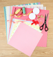 Paper For Scrapbooking And Tools, On Wooden Table
