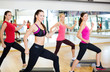 © Syda Productions - group of smiling people doing aerobics