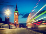 Fototapeta Big Ben - London, the UK. Red bus in motion and Big Ben at night