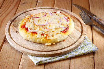 Mini pizza. homemade on wooden plate