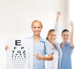 Poster - smiling female doctor or nurse with eye chart