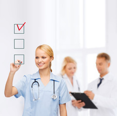 Sticker - doctor or nurse drawing checkmark into checkbox