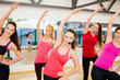 © Syda Productions - group of smiling people stretching in the gym