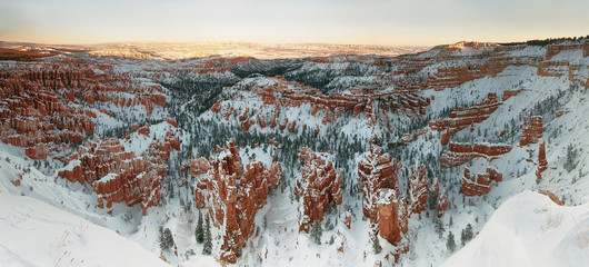 Wall Mural - Bryce canyon panorama with snow in Winter at sunset, USA