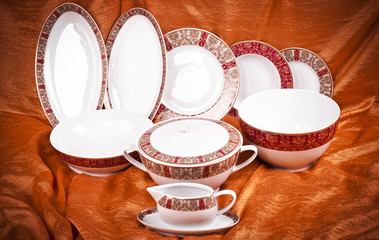 Dinnerware set on orange background