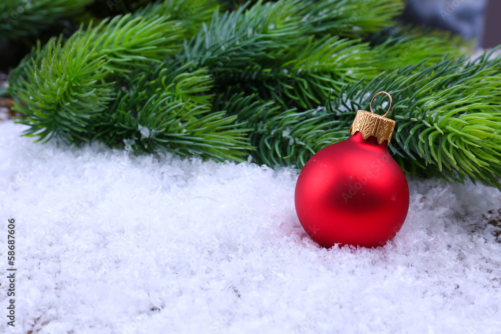 Christmas ball and fir tree on light background