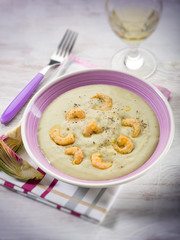 Wall Mural - soup with artichoke and shrimp, selective focus