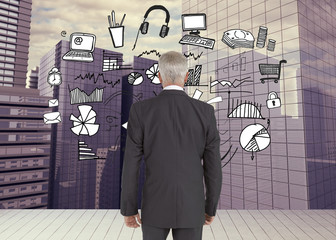 Poster - Composite image of businessman walking away from camera