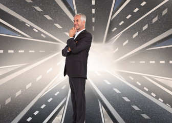 Poster - Composite image of happy businessman looking away