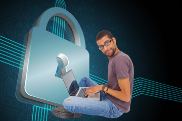 Poster - Composite image of man wearing glasses sitting on floor using la