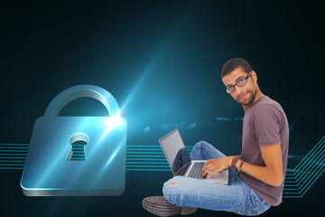 Poster - Composite image of man wearing glasses sitting on floor using la