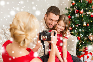 Canvas Print - mother taking picture of father and daughter