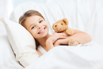 Poster - little girl with teddy bear sleeping at home