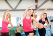 © Syda Productions - group of smiling people stretching in the gym