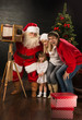 © Milles Studio - Santa Claus taking picture of full family with old wooden camera