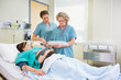 Nurses Inspecting Fetal Monitor Report