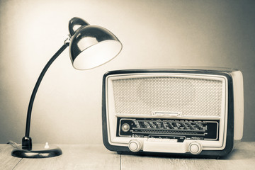 Poster - Retro old desk lamp and radio on table sepia photography