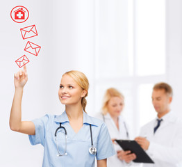 Sticker - smiling doctor or nurse pointing to envelope