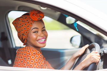 african female driver inside a car