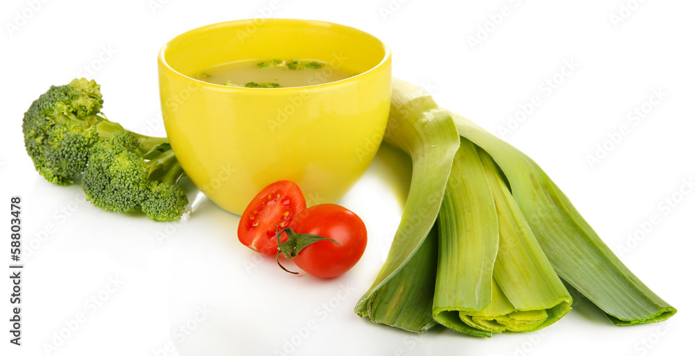 Diet soup with vegetables in cup isolated on white