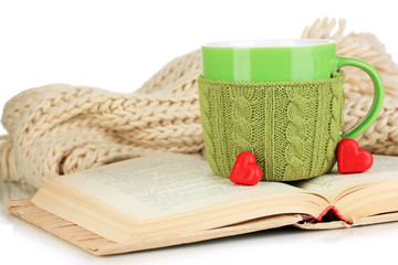 Aufkleber - Cup with knitted thing on it and open book close up