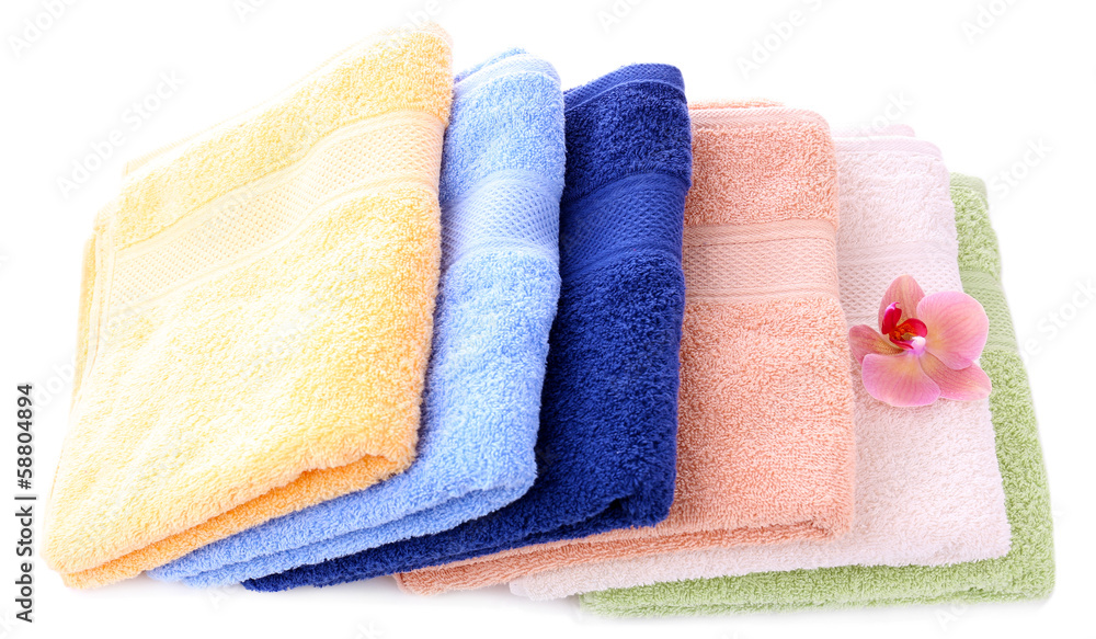 Orchid flower and towels, isolated on white