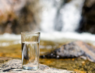 Canvas Print - Glass of water by waterfall