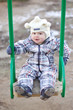 baby age of 1 year on seesaw outdoors
