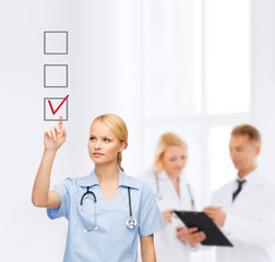 Poster - smiling doctor or nurse pointing to checkmark