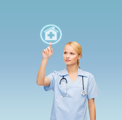 Sticker - smiling doctor or nurse pointing to hospital icon