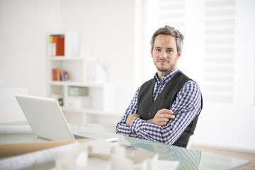 Wall Mural - architect working at his laptop on the office