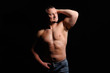 © Art_man - Muscular male posing on black background