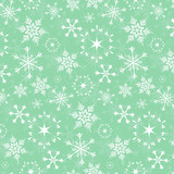 Fototapeta  - Seamless vector pattern - white snowflakes on green background