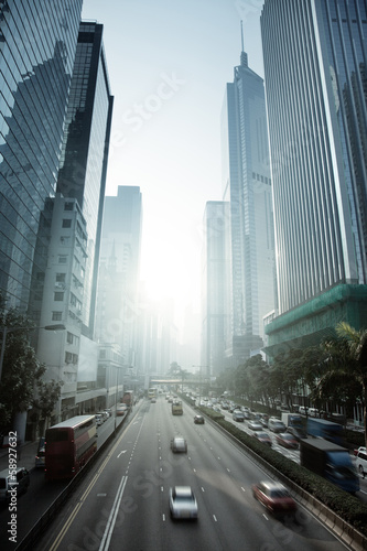 Naklejka samoprzylepna Hong kong dzielnicy biznesowej w zachód słońca