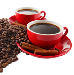 Red cups of strong coffee and coffee beans close up