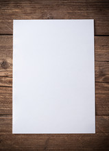 White Paper On Wood Background