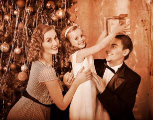 Wall Mural - Family with children  dressing Christmas tree.