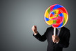 © ra2 studio - Businessman holding a lollipop