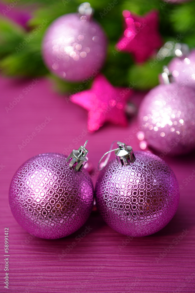 Christmas balls on fir tree, on color background