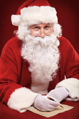 Wall Mural - Portrait of Santa Claus looking at envelope in his hands