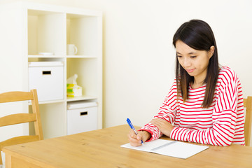 Sticker - Asian woman writing on notebook