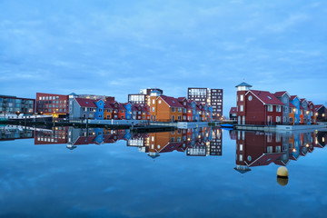 Fototapete - colorful buildings on water at marina Reitdiephaven