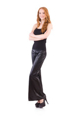 Wall Mural - Redhead woman in black bell bottom pants on white