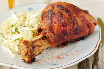 Roasted pork shank with fresh cabbage salad