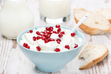 Fototapeta Tulipany - homemade yogurt with pomegranate, milk and bread, close-up