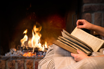 Wall Mural - reading book by fireplace