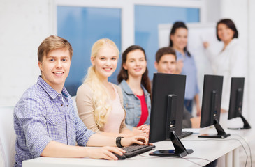 students with computer monitor at school